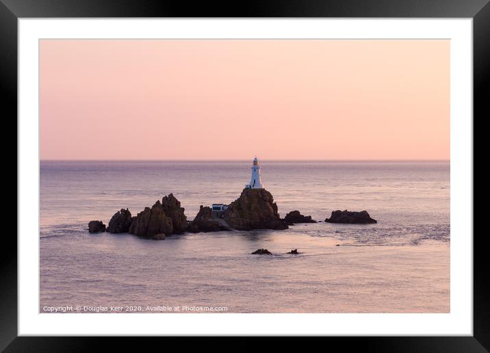 La Corbière lighthouse at sunset, Jersey. Framed Mounted Print by Douglas Kerr