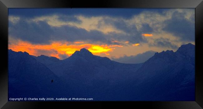 Firey Sunset over the Peaks of Arran Framed Print by Charles Kelly