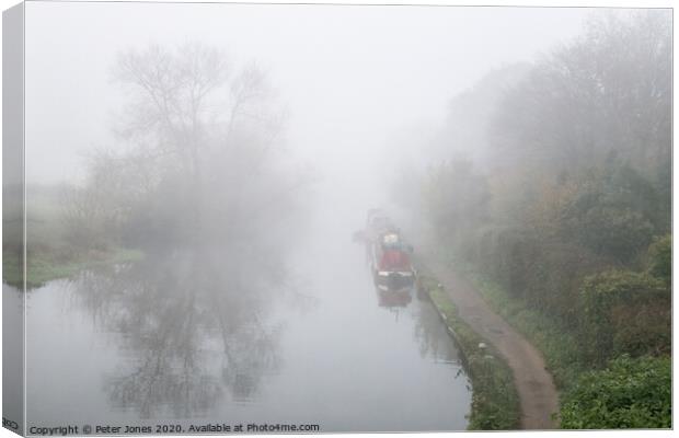 Mist over the Grand Union Canal Canvas Print by Peter Jones