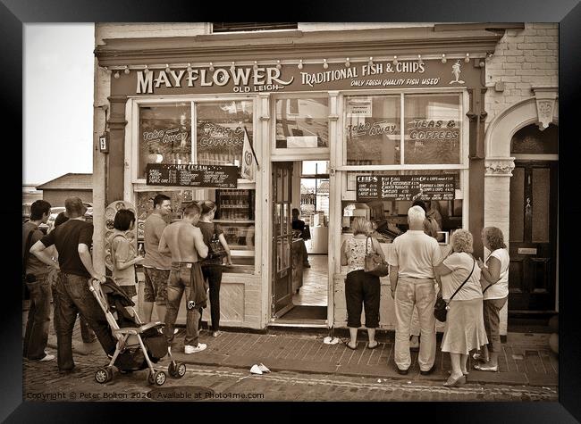 People queue outside a traditional fish and chip shop at Old Leigh, Essex. Framed Print by Peter Bolton