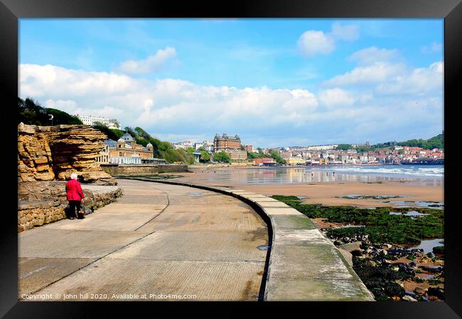 Walking the promenade towards Scarborough in Yorkshire. Framed Print by john hill