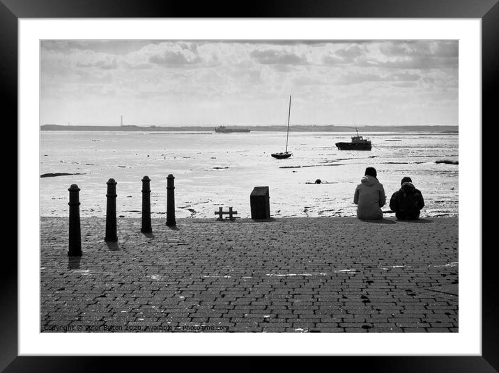 Sitting on the edge of the dock taking in the view. Old Leigh, Essex, UK. Framed Mounted Print by Peter Bolton