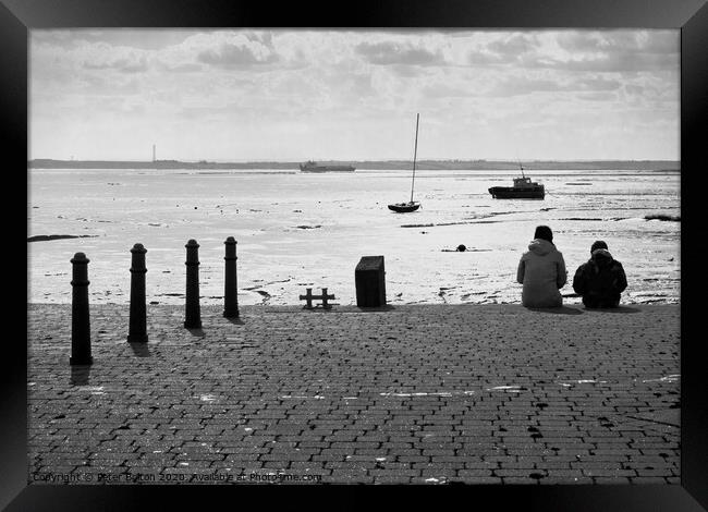 Sitting on the edge of the dock taking in the view. Old Leigh, Essex, UK. Framed Print by Peter Bolton