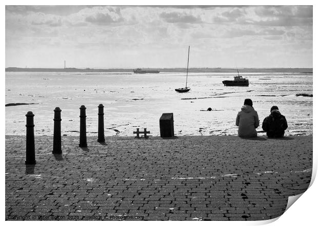 Sitting on the edge of the dock taking in the view. Old Leigh, Essex, UK. Print by Peter Bolton