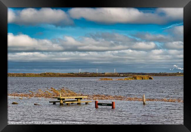 Flooded benches on a parking spot near Skjern in Denmark Framed Print by Frank Bach