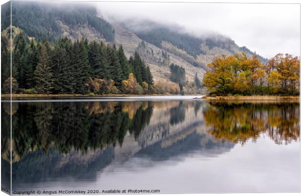 Loch Chon reflections Canvas Print by Angus McComiskey
