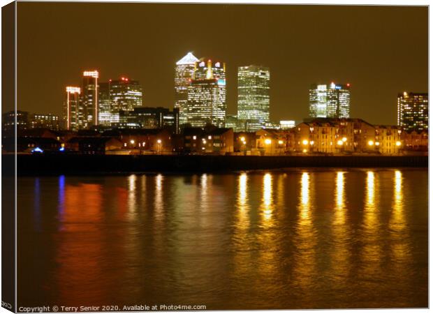 Nightscene of Canary Wharfe on the Isle of Dogs  Canvas Print by Terry Senior