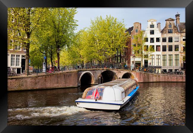 Canal Boat in Amsterdam Framed Print by Artur Bogacki