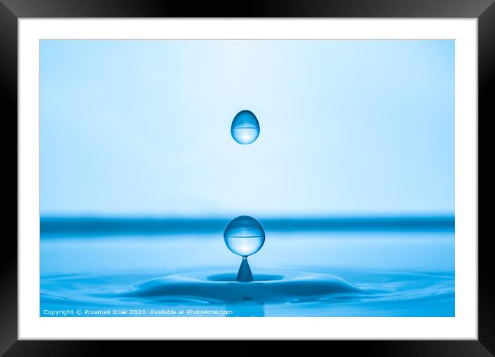 Water drop splashing into blue water surface Framed Mounted Print by Przemek Iciak