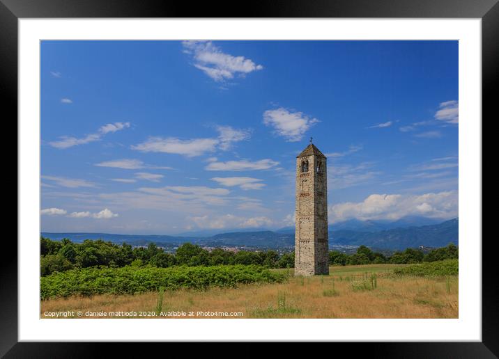 the solitary medieval stone bell tower Framed Mounted Print by daniele mattioda