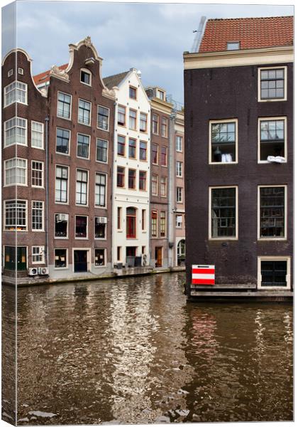 Canal Houses In Amsterdam Canvas Print by Artur Bogacki