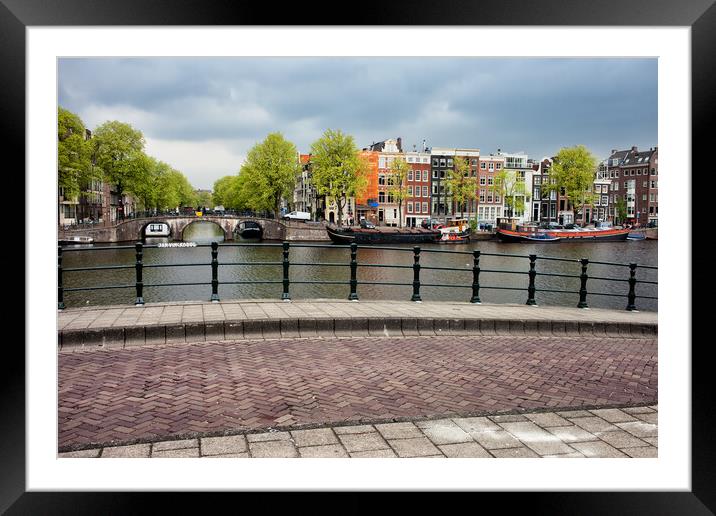 Houses by the Amstel River in Amsterdam Framed Mounted Print by Artur Bogacki