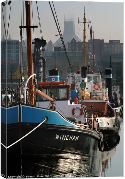 Liverpool Canning Dock Cargo Vessel and Tug Boats Canvas Print by Bernard Rose Photography