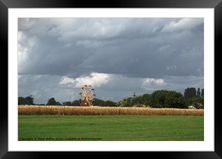 Ferris wheel at a country show viewed from across a wheat field. Damyns Hall Aerodrome, Essex, UK. Framed Mounted Print by Peter Bolton
