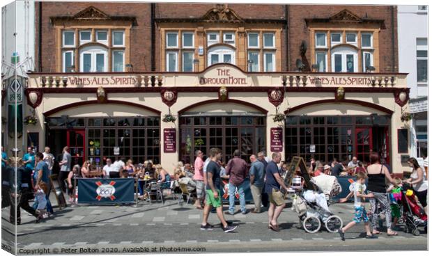 Summer visitors outside the old Borough Hotel public house on the seafront at Southend on Sea, Essex. Canvas Print by Peter Bolton