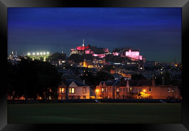 Edinburgh Castle under pink floodlights Framed Print by Philip Hawkins