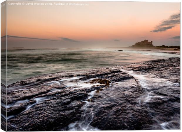 Bamburgh Castle, view from Harkness Rocks Canvas Print by David Preston