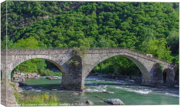  The medieval  bridge of Echallod in Arnad, Italy Canvas Print by susanna mattioda