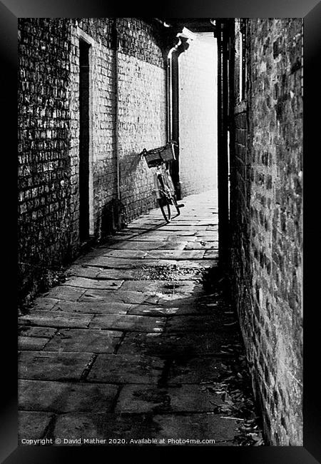 Cycle in the Alley Framed Print by David Mather