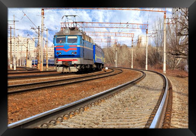Perspective and turn of a multichannel railway for electric trains Framed Print by Sergii Petruk