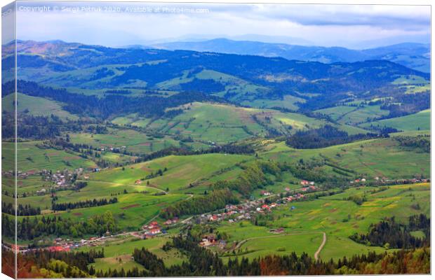 Beautiful landscape of the Carpathian mountains, Ukraine. View of the village from the top of the mountain. Canvas Print by Sergii Petruk