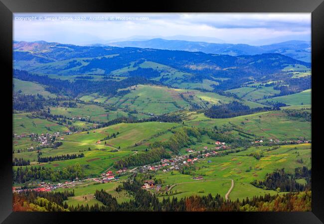 Beautiful landscape of the Carpathian mountains, Ukraine. View of the village from the top of the mountain. Framed Print by Sergii Petruk