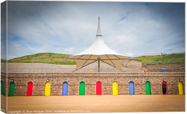 Barry island colourful doors and massive parasol Canvas Print by Bryn Morgan