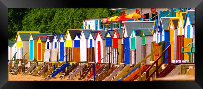 Bright Beach huts Framed Print by Dave Bell