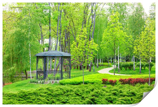 Openwork metal arbor with forged elements surrounded by beautiful spring park with landscape design. Print by Sergii Petruk