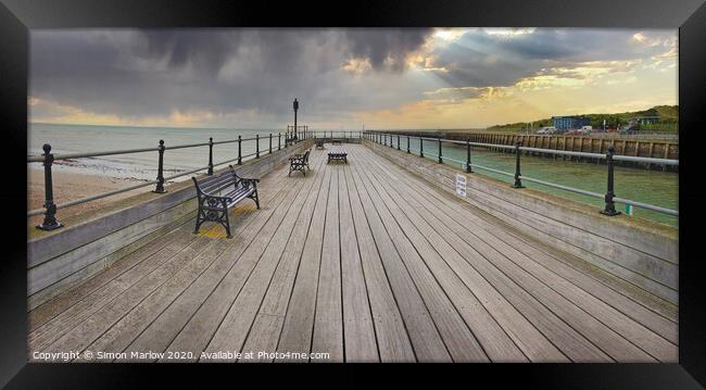 A look down the pier at Littlehampton Framed Print by Simon Marlow