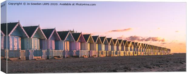 Sunset at West Mersea Beach Huts Canvas Print by Jo Sowden