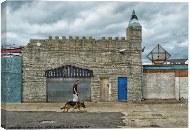 Man and dog walk in front of abandoned seaside arcade at Southend on Sea, Essex. Canvas Print by Peter Bolton