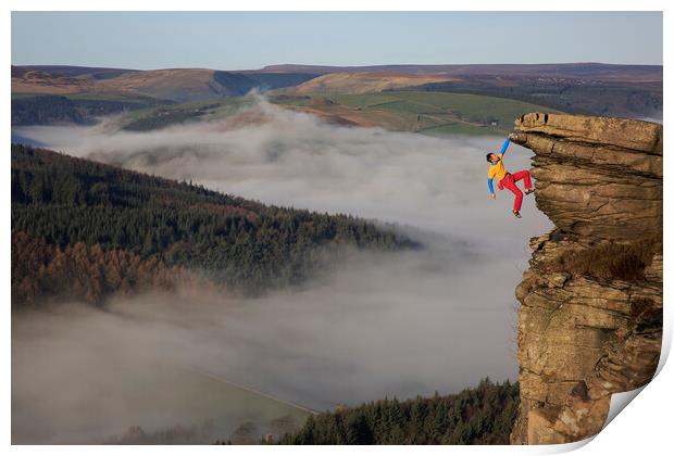 A rock climber free climbing on bamford edge in th Print by MIKE HUTTON