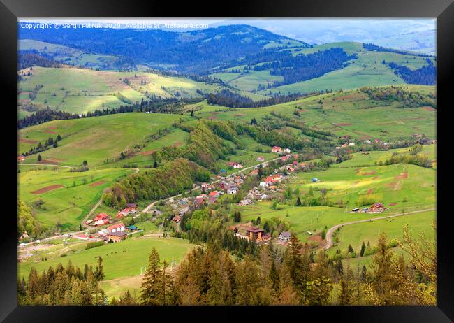 Beautiful landscape of the Carpathian Mountains, Ukraine, overlooking the village from the top of the mountain. Framed Print by Sergii Petruk
