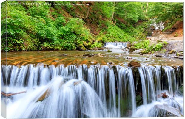 Picturesque and beautiful cascade waterfall of a mountain river in the Carpathians. Canvas Print by Sergii Petruk