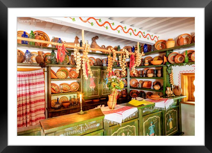 Design and interior of an old cafe, shop, earthenware dishes in an old Ukrainian rural house. Framed Mounted Print by Sergii Petruk