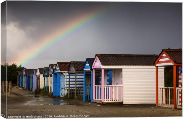 Rainbow over the Beach Huts Canvas Print by Heidi Stewart