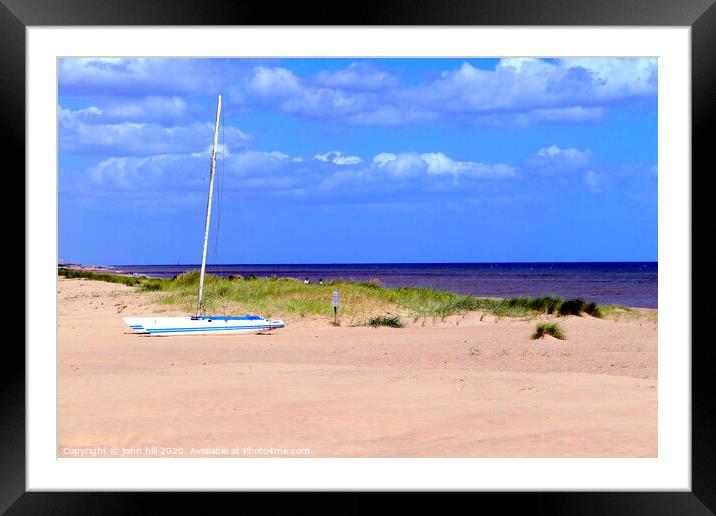 Beached Catermaran sailboat.  Framed Mounted Print by john hill