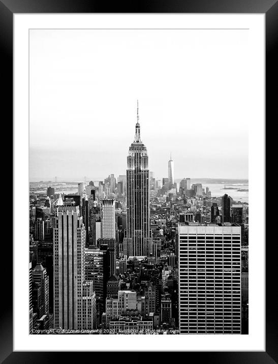 Aerial night view of Manhattan skyline in New York Framed Mounted Print by Antonio Gravante