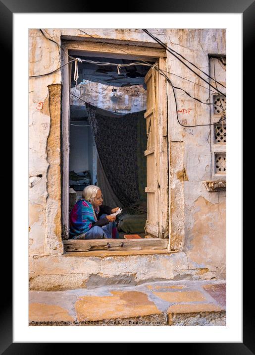 Lady reading letter in doorway, Jaisalmer Fort. Framed Mounted Print by Chris North