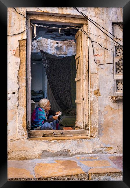 Lady reading letter in doorway, Jaisalmer Fort. Framed Print by Chris North