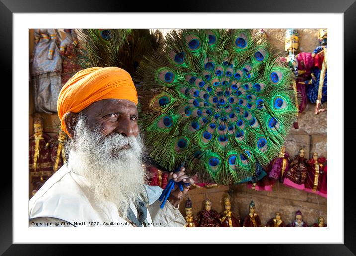 Peacock fan Seller at Jaisalmer Fort, India. Framed Mounted Print by Chris North