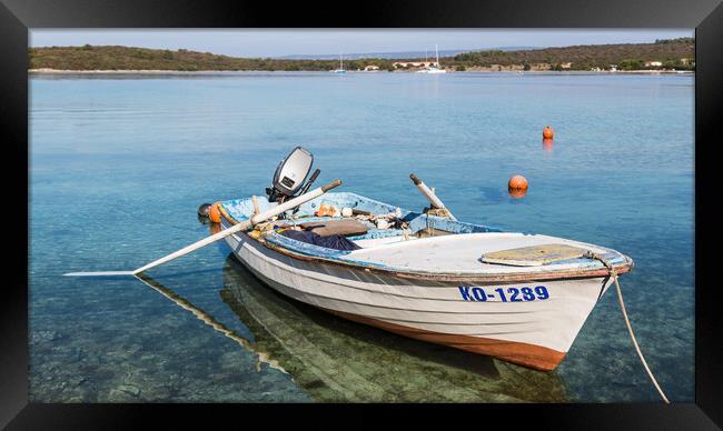 Fishing boat in the shallow waters Framed Print by Jason Wells