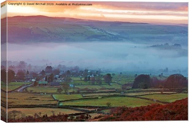 Misty winter sunset viewed from  Curbar Edge. Canvas Print by David Birchall