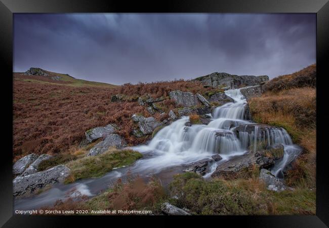 Welsh Waterfall under a moody sky Framed Print by Sorcha Lewis
