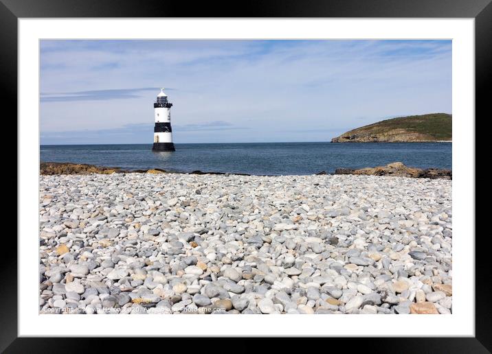 Penmon lighthouse and shingle beach Framed Mounted Print by Kevin Hellon