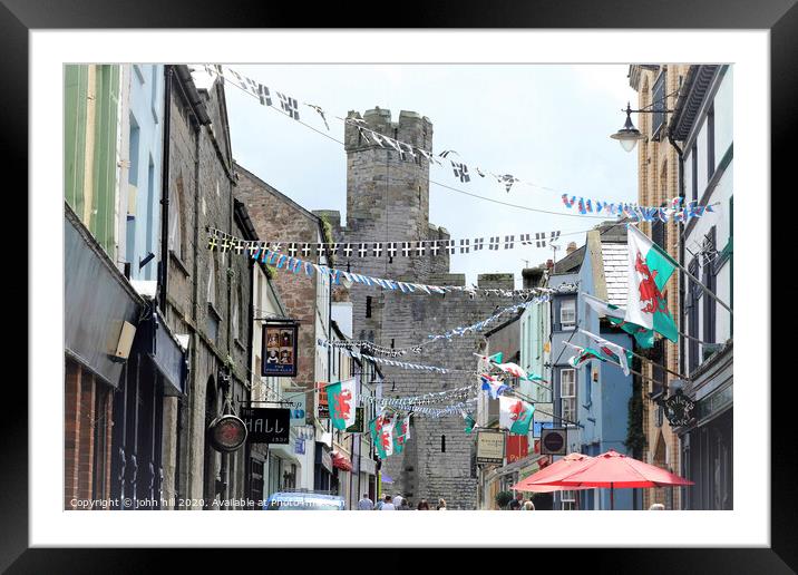 Flags and bunting at Caernarfon in Wales. Framed Mounted Print by john hill