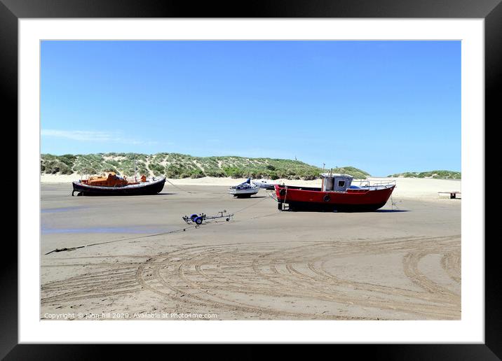 Beached boats on the beach at Barmouth in Wales. Framed Mounted Print by john hill