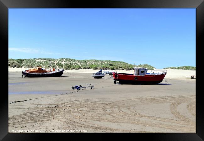 Beached boats on the beach at Barmouth in Wales. Framed Print by john hill