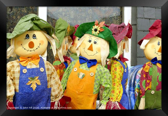 Homemade Scarecrows for sale outside a shop at Porthmadog in Wales.  Framed Print by john hill
